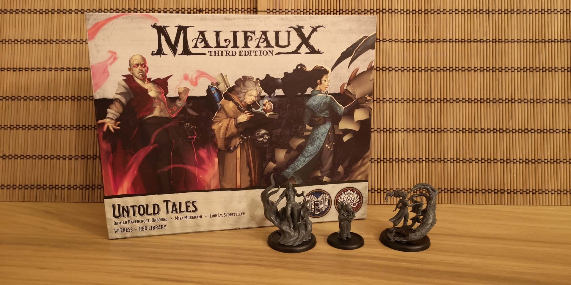 Malifaux Untold Tales box and miniatures.